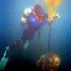 Seadart Diver Chris lifting a large rock with air bags.